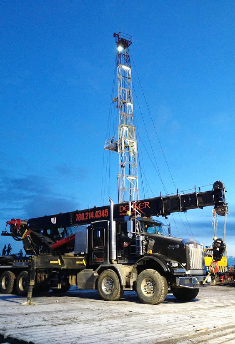 Dekker Oilfield Services picker truck on oil well